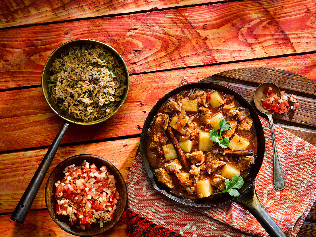 Lamb pilaf with rice and kachumbari salad (Kenyan fresh tomato and onion salad)