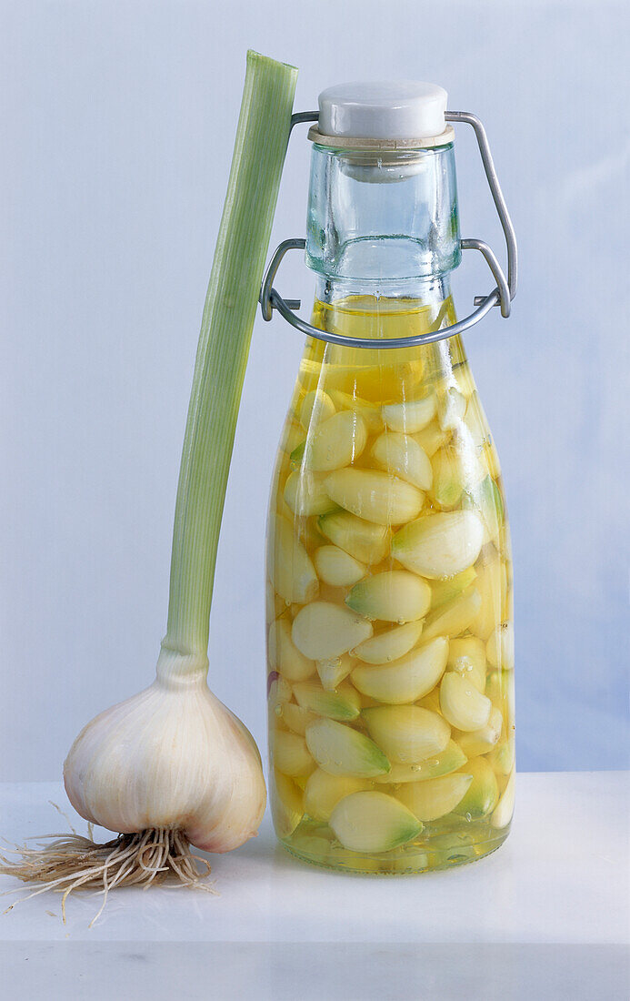 Homemade garlic oil in a flip-top bottle