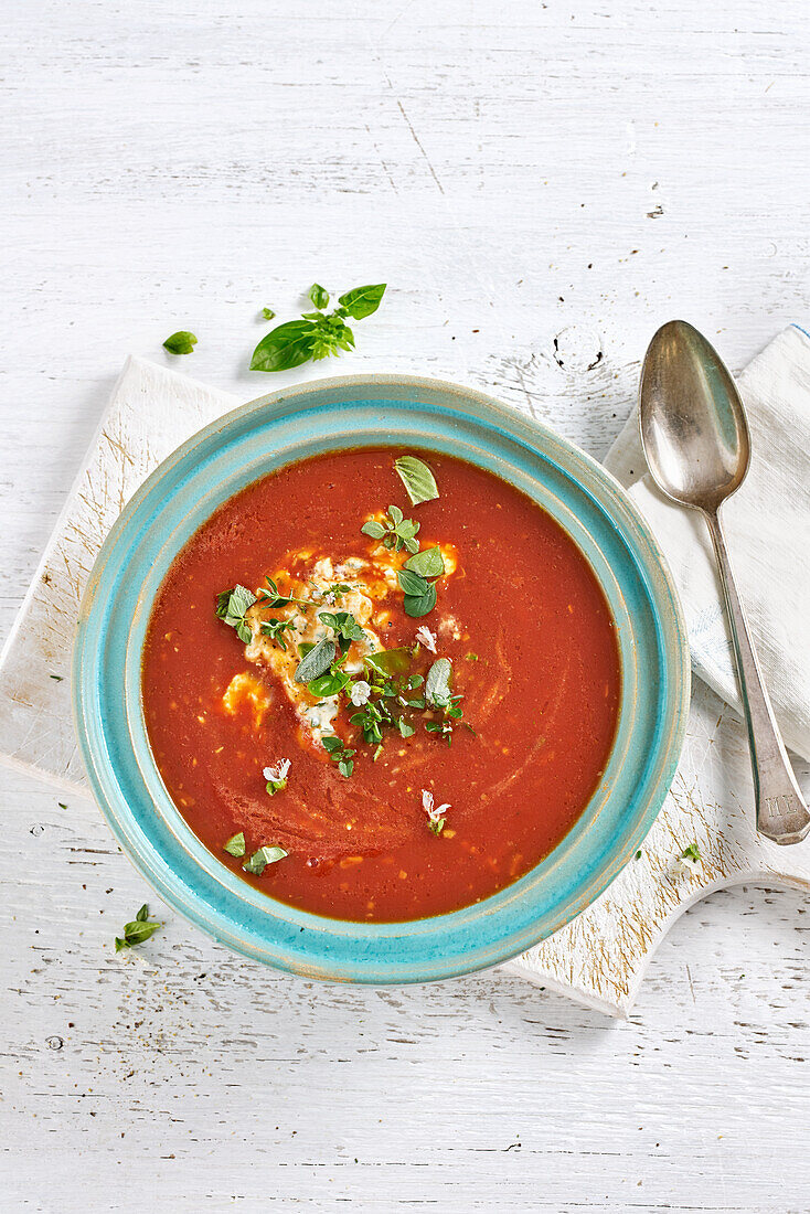 Quick tomato soup with creme fraiche and Mediterranean herbs