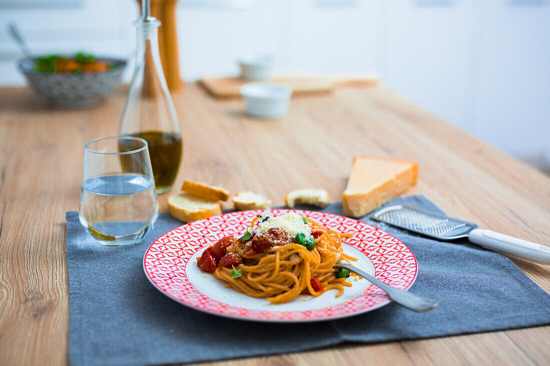 Spaghetti with cherry tomatoes and basil on a plate