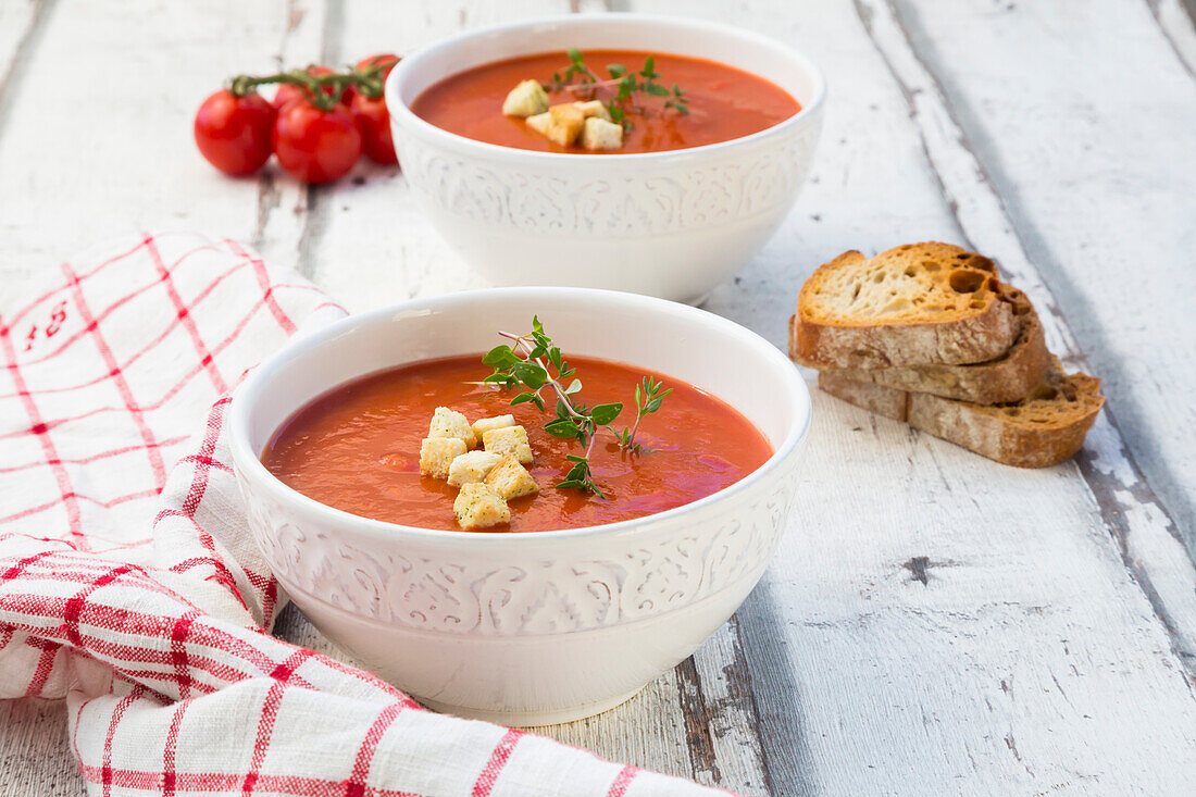 Mediterran tomato soup with roasted bread, croutons and thyme