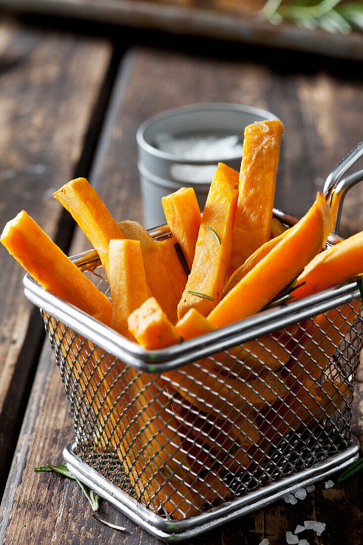 Sweet potato fries with rosmary in chip basket