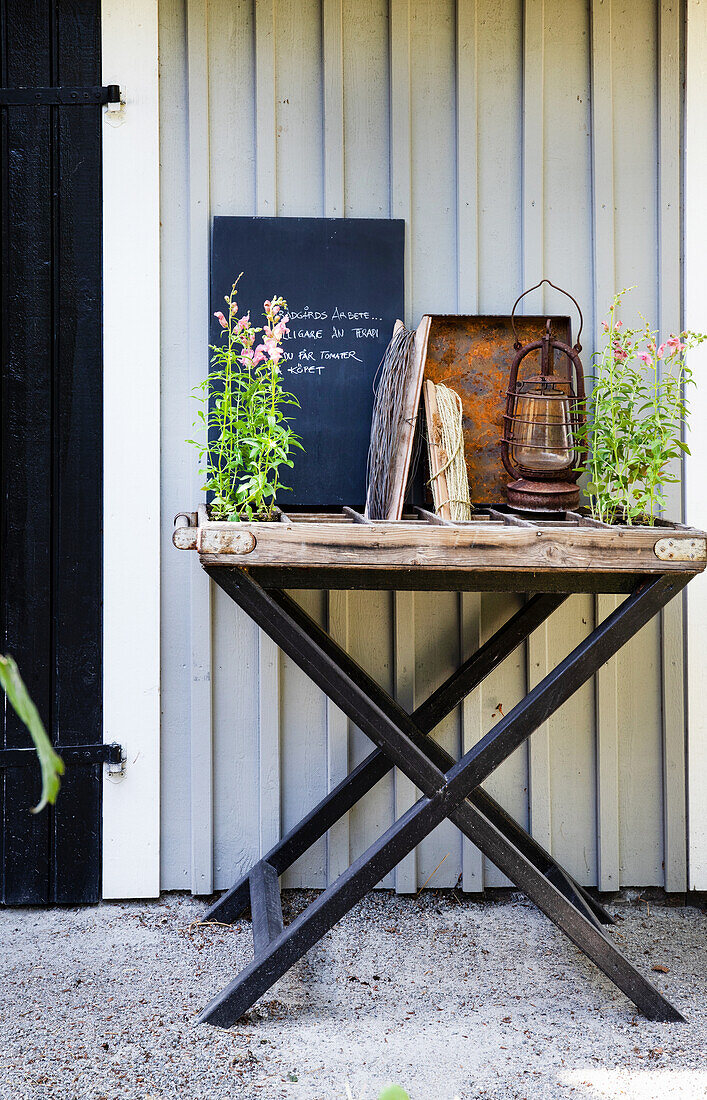 Flowers and vintage lantern on folding table