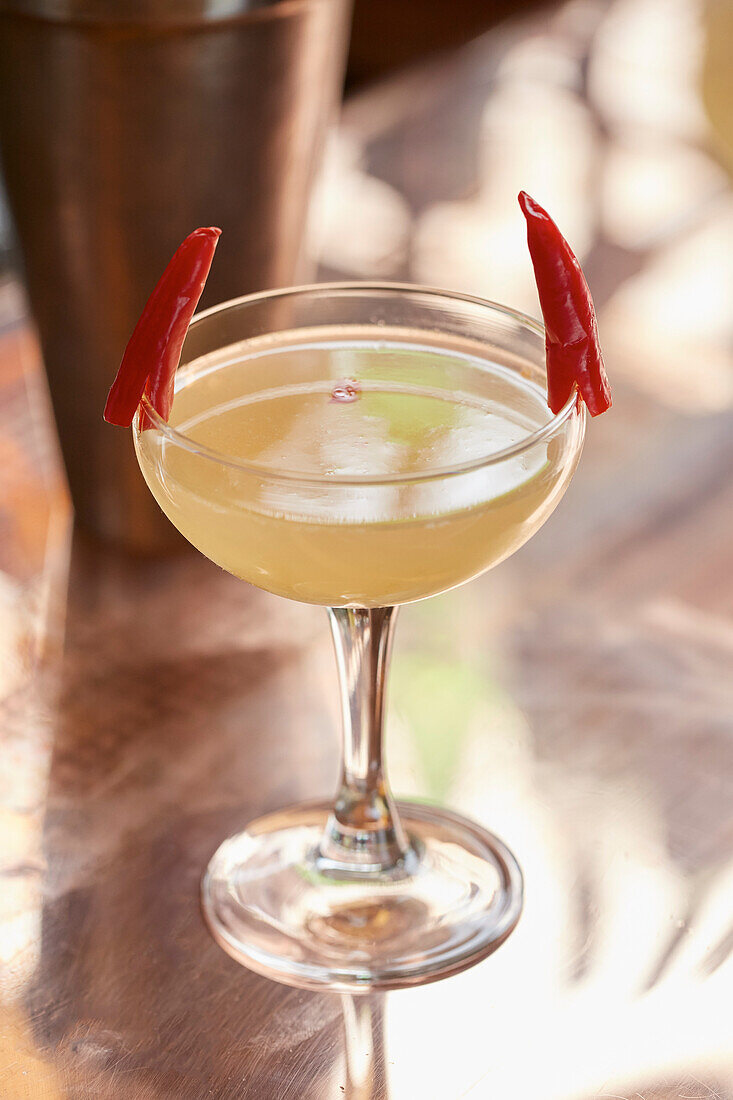 A chilli cocktail garnished with fresh red chillies