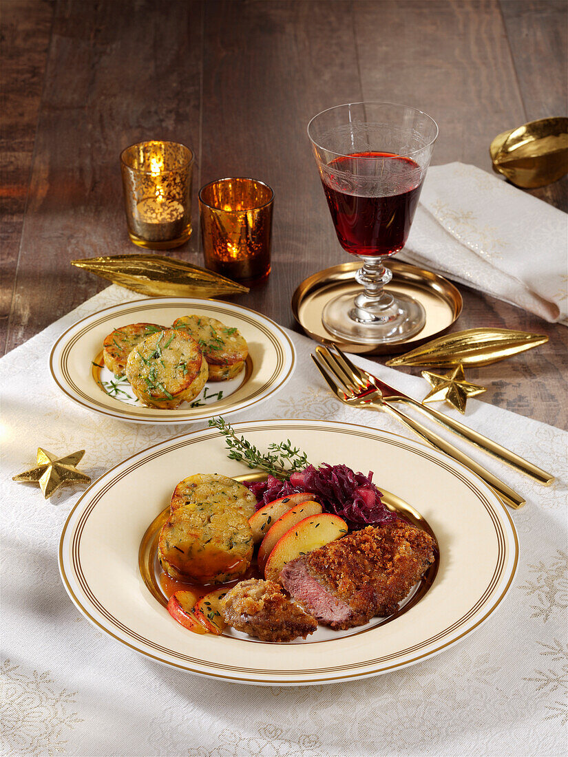 Goose schnitzel on red cabbage with napkin dumplings for Christmas