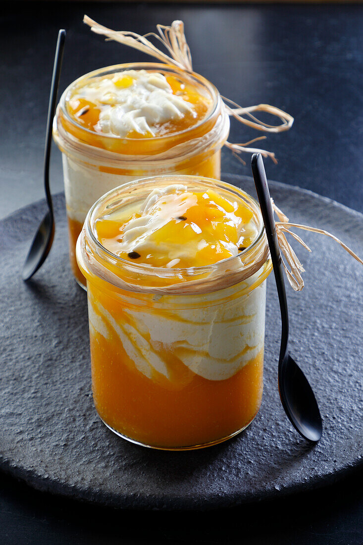Dessert in a jar with mango mousse and mascarpone cheese