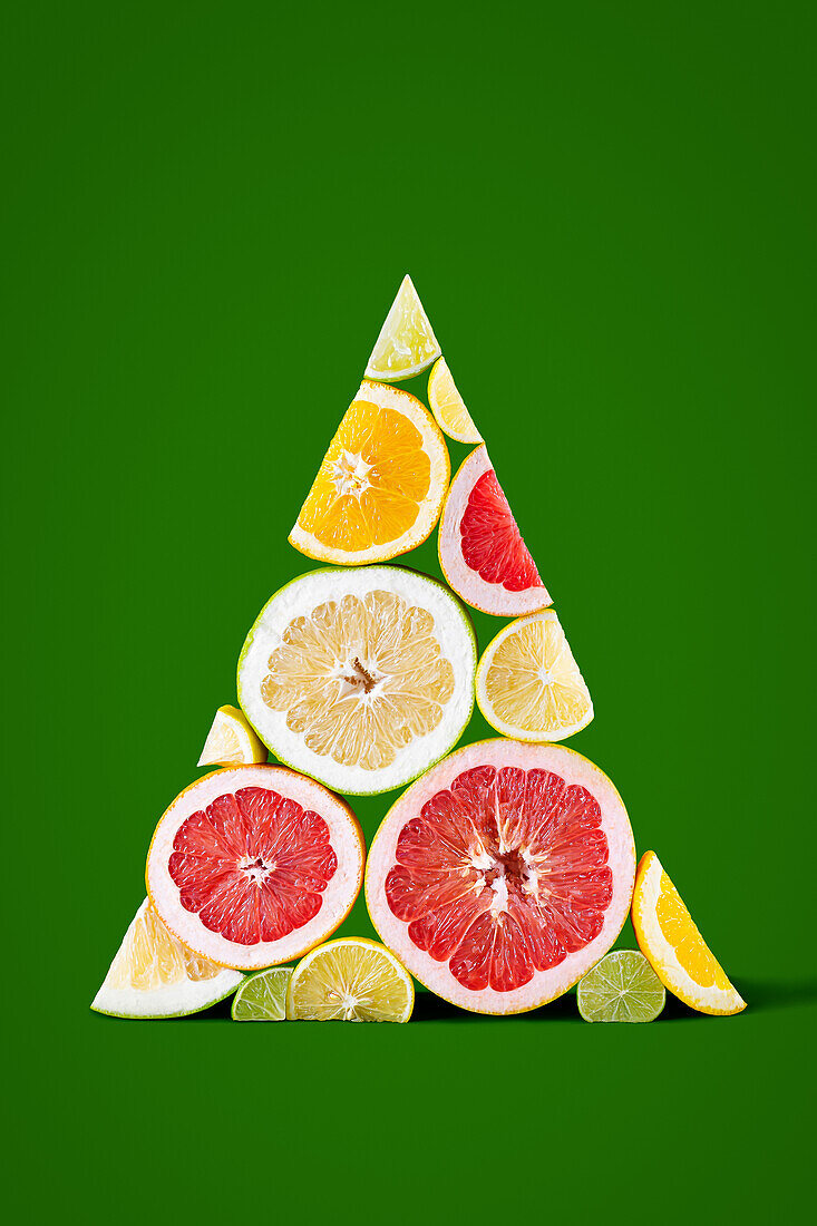 Citrus slices arranged in triangular Christmas tree shape