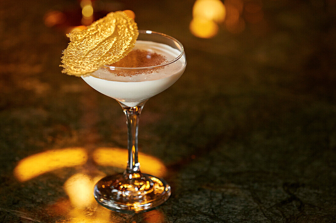 A brandy snap garnished cocktail