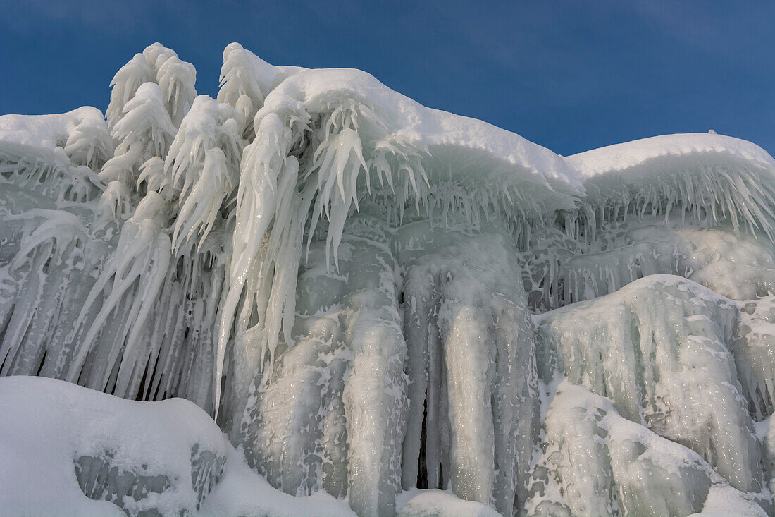 Ice stalactites along the bank of Tornetrask Lake, Sweden
