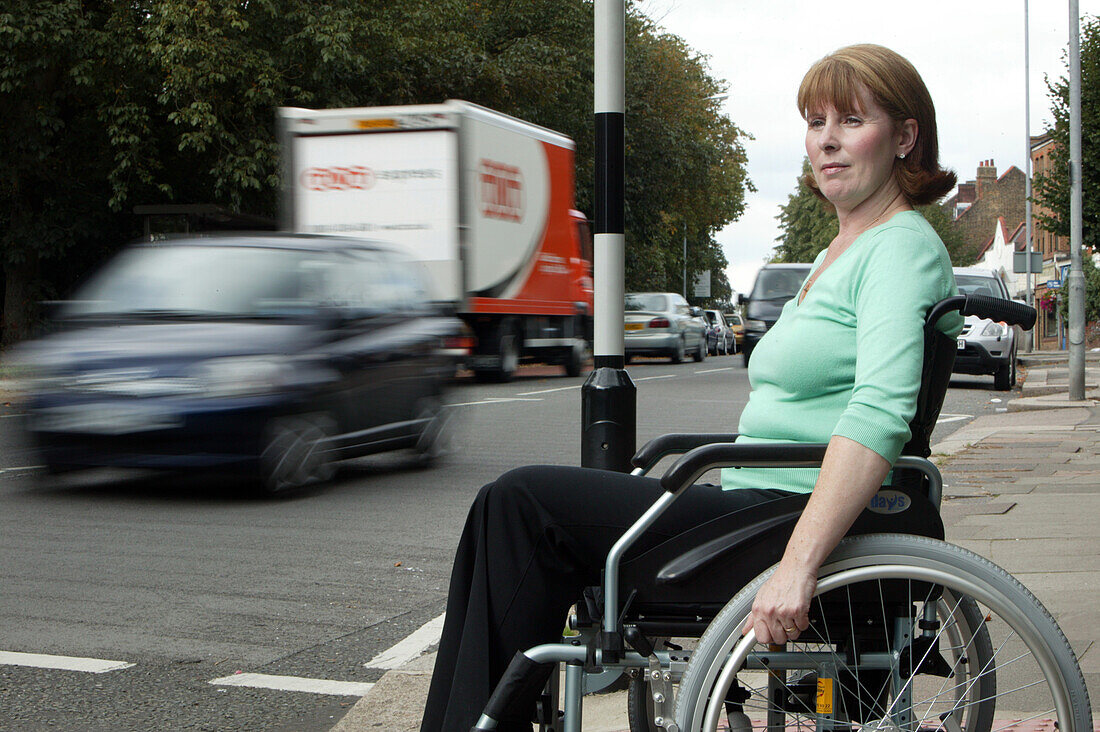 Wheelchair user crossing road