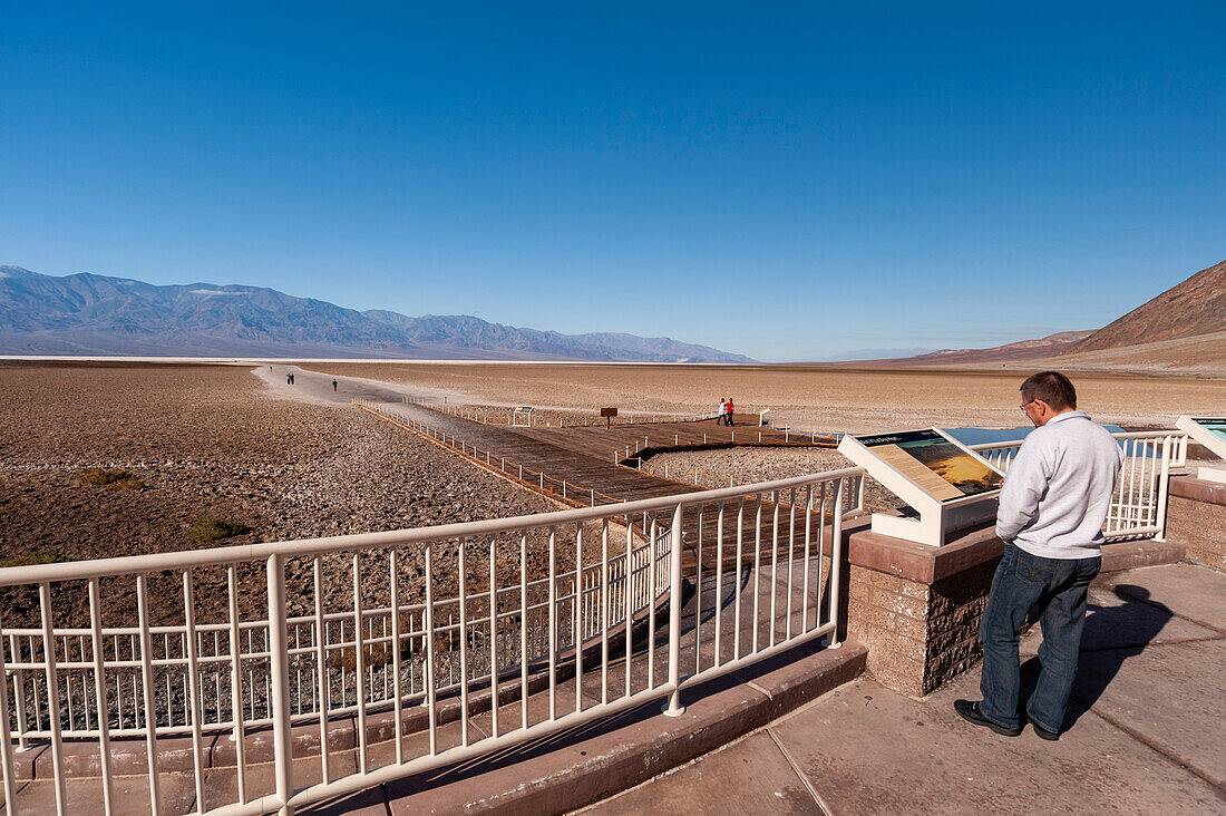 Tourist at the observation deck of Badwater Basin, USA