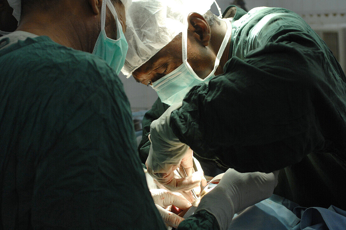 Surgeon and assistants during an operation