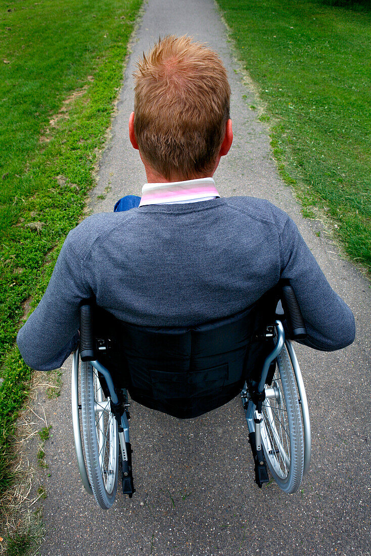 Man in wheelchair in park