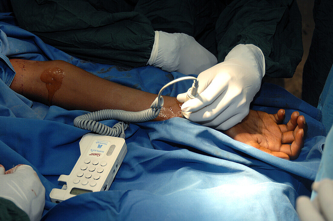 Surgeons checking for pulse