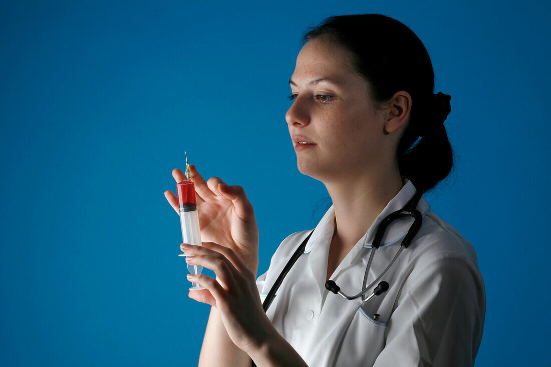 Nurse holding syringe