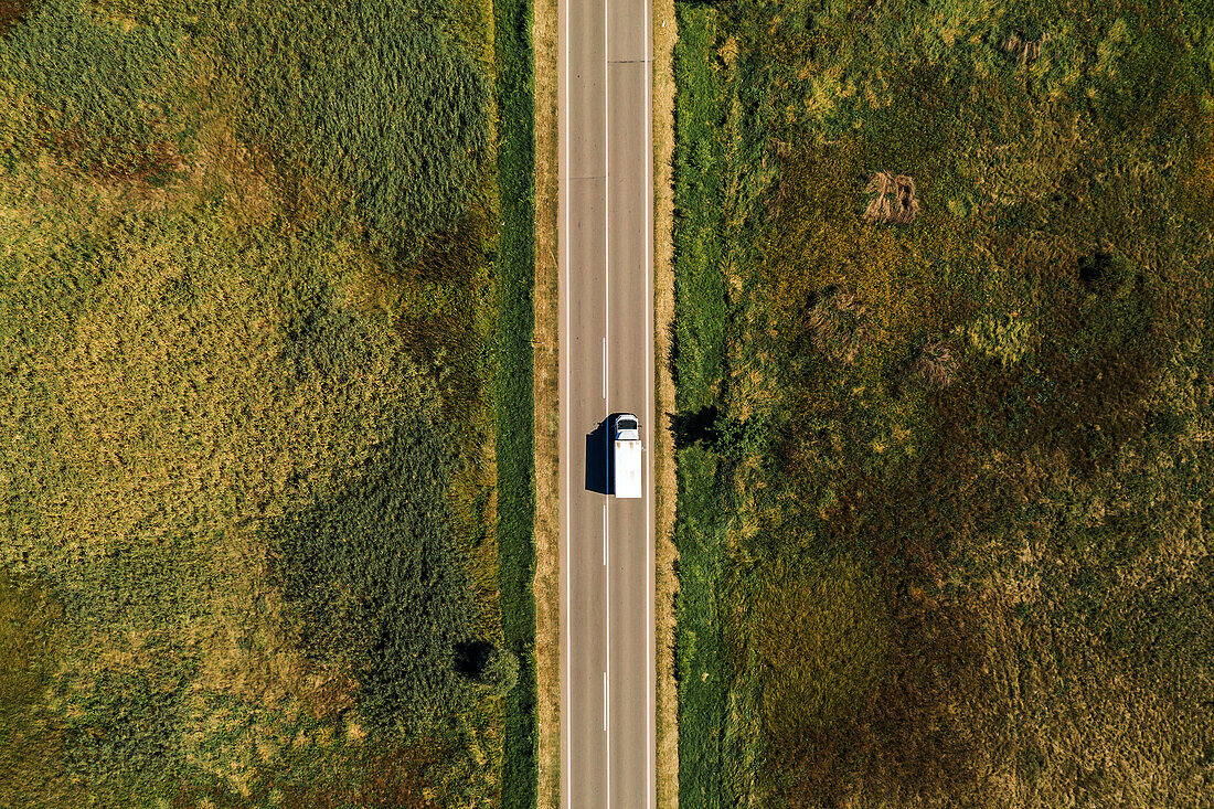 Lorry on rural road, aerial view