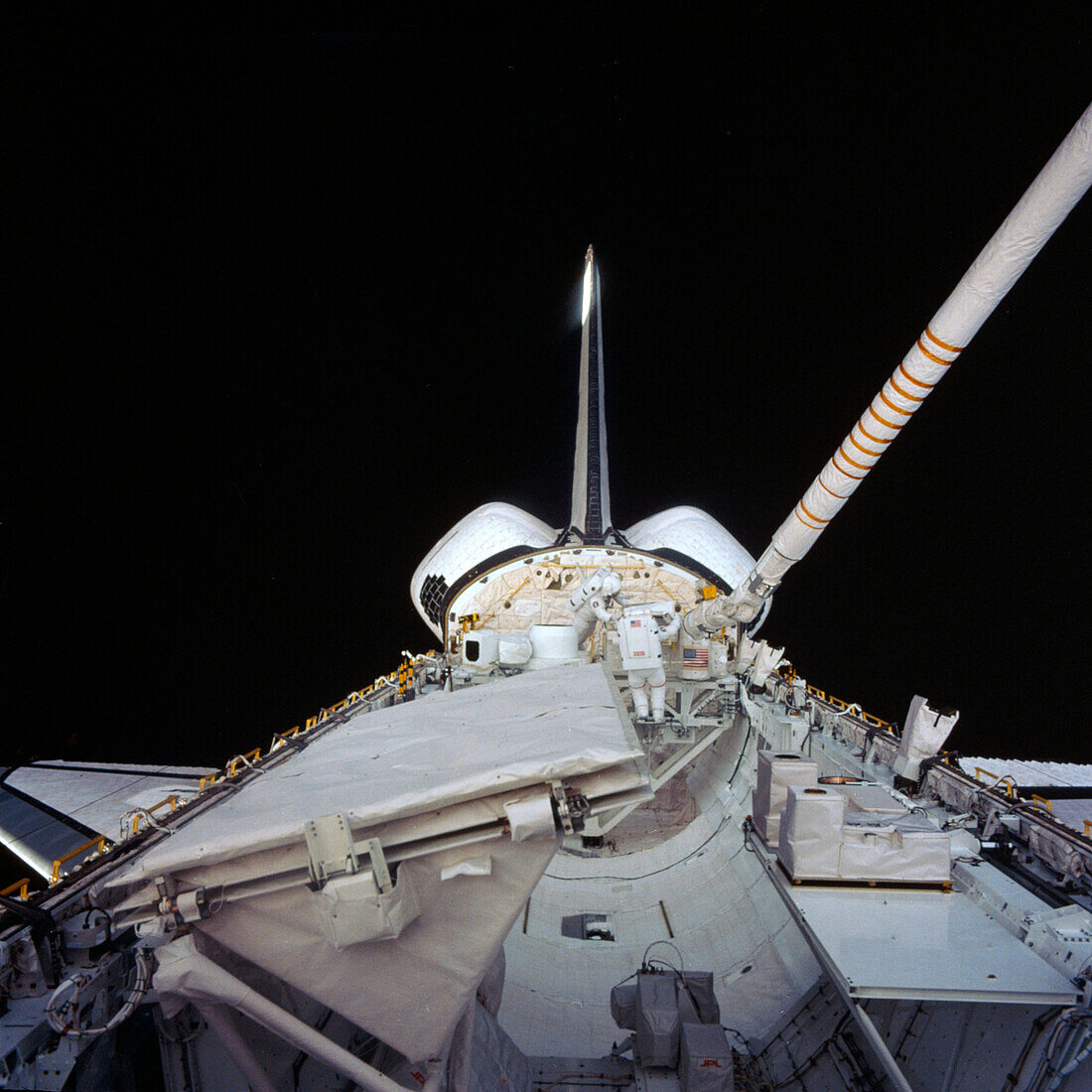Space shuttle astronauts spacewalk