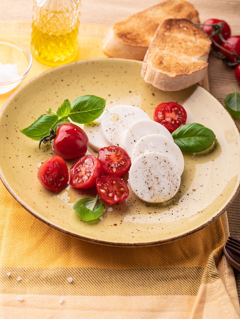 Vegan 'Mozzarella' with olive oil, tomatoes and basil