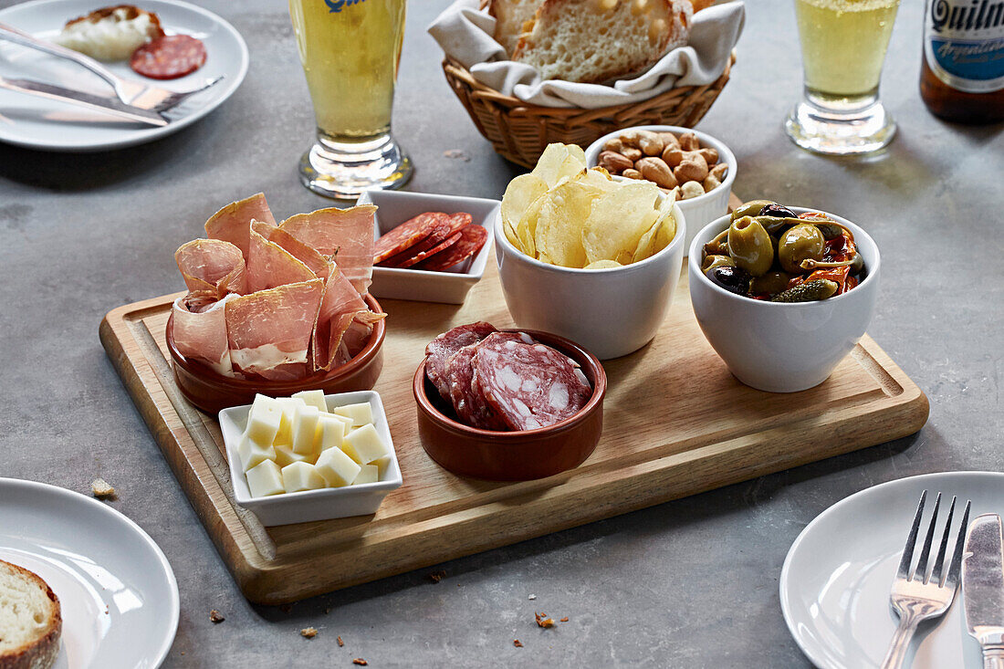 Snack selection board- cured meats, cheese, olives, nuts and crisps