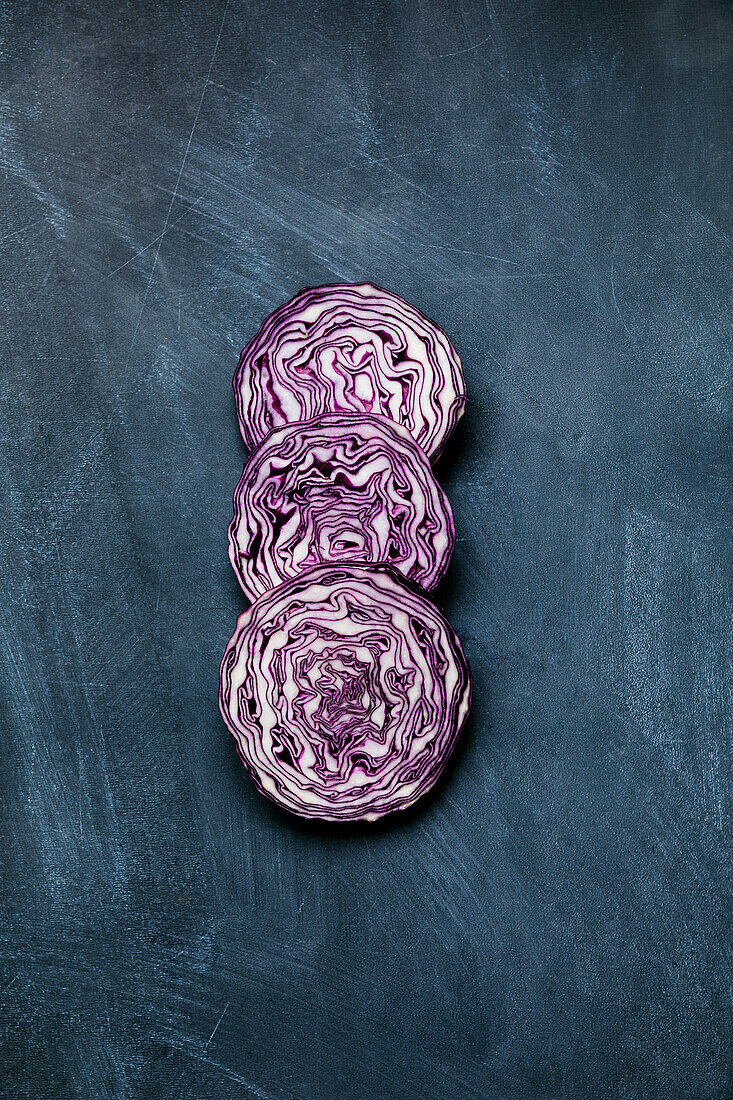 Red cabbage slices on a dark background