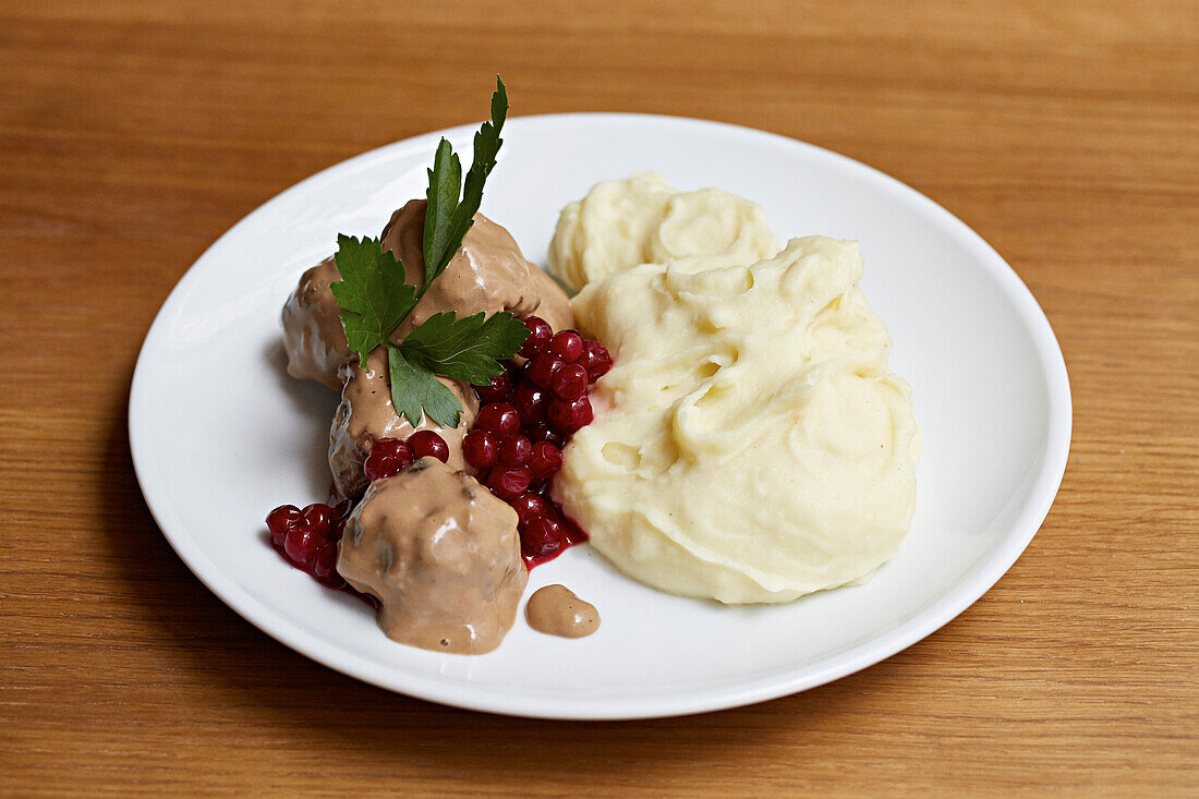 Meatballs, creamed mash and redcurrants