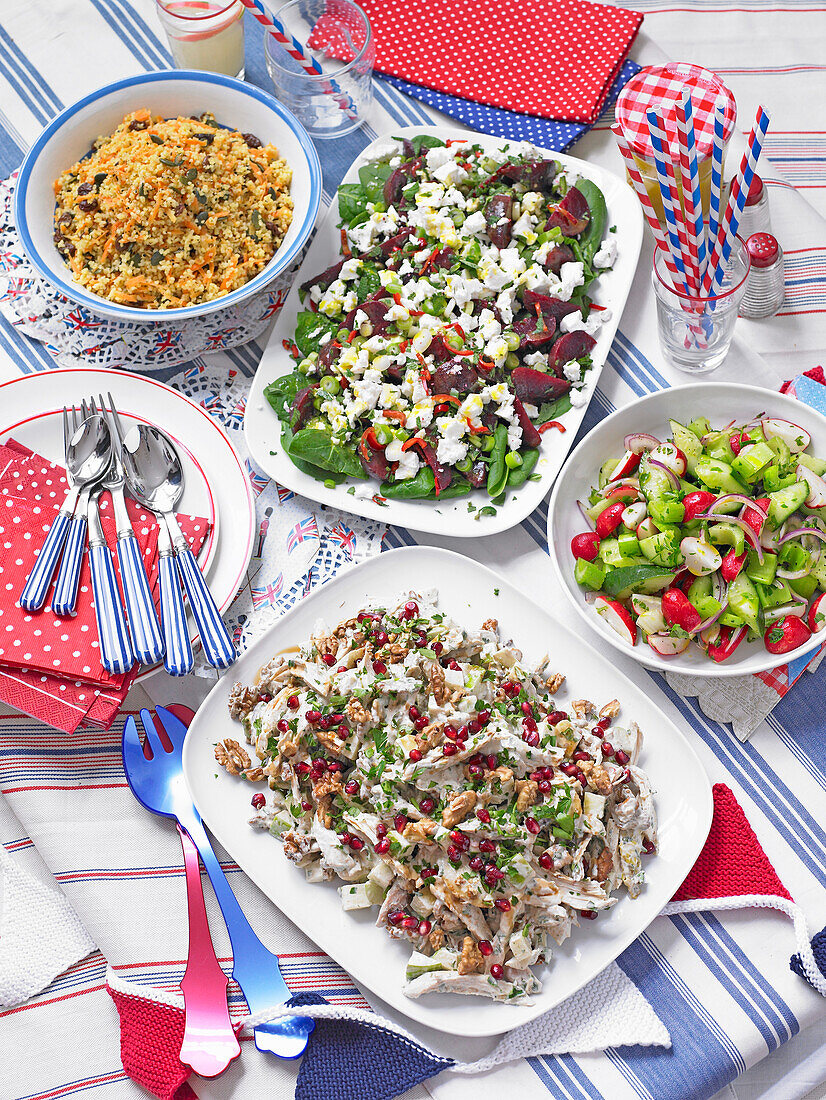 Various party salads on a set table