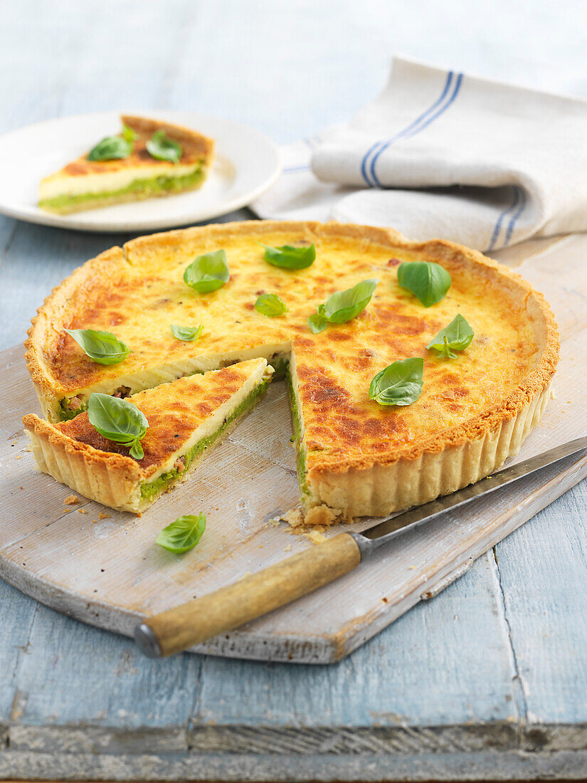 Vegetable tart with peas, beans and bacon