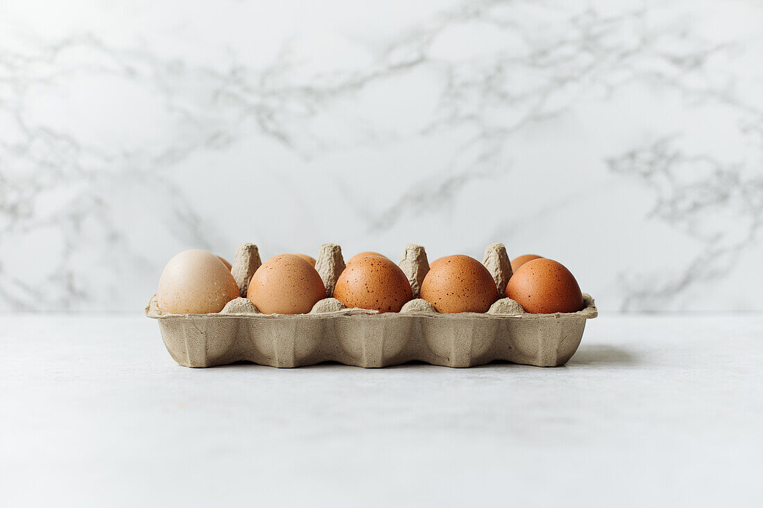 Fresh eggs in an egg box