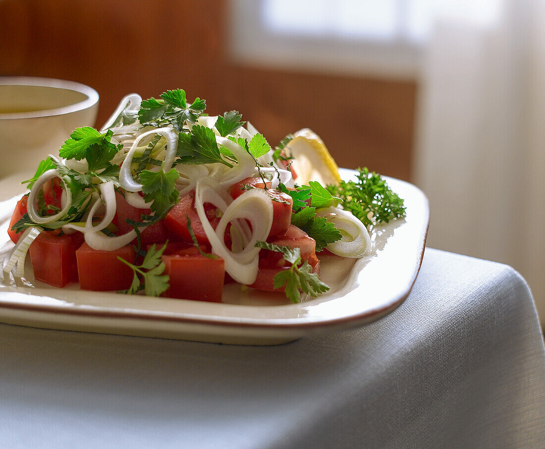 Tomato salad with onions and fresh herbs