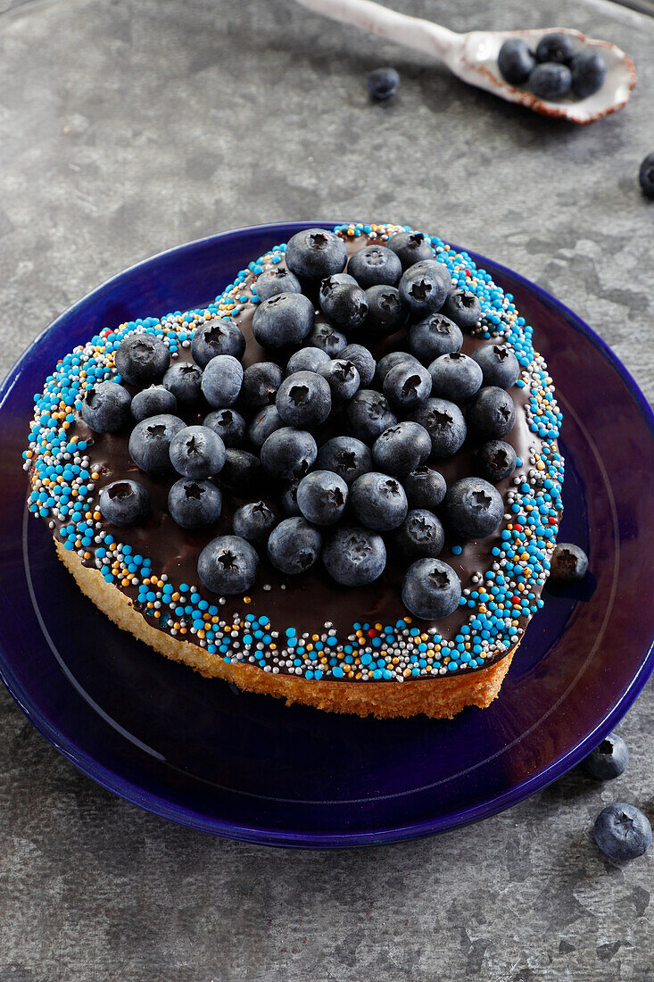 Heart-shaped cake with blueberries