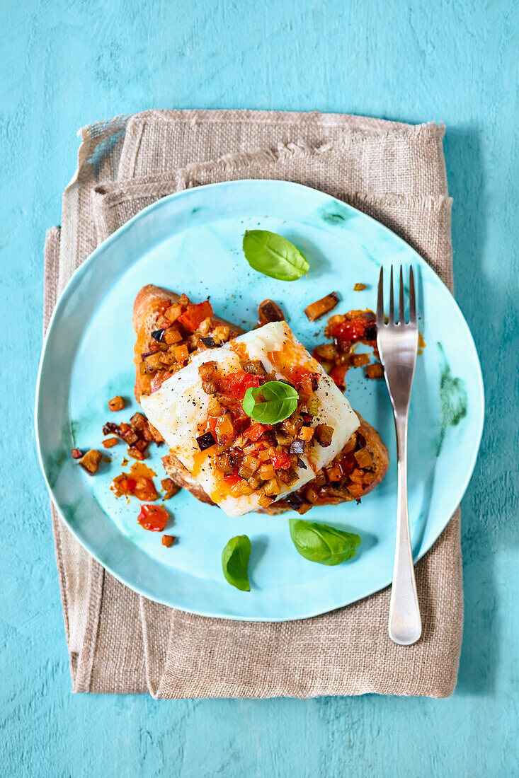 Fried cod with an aubergine and tomato salsa