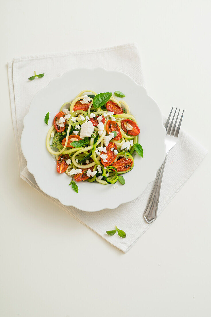 Zoodles with cherry tomatoes and primosale cheese