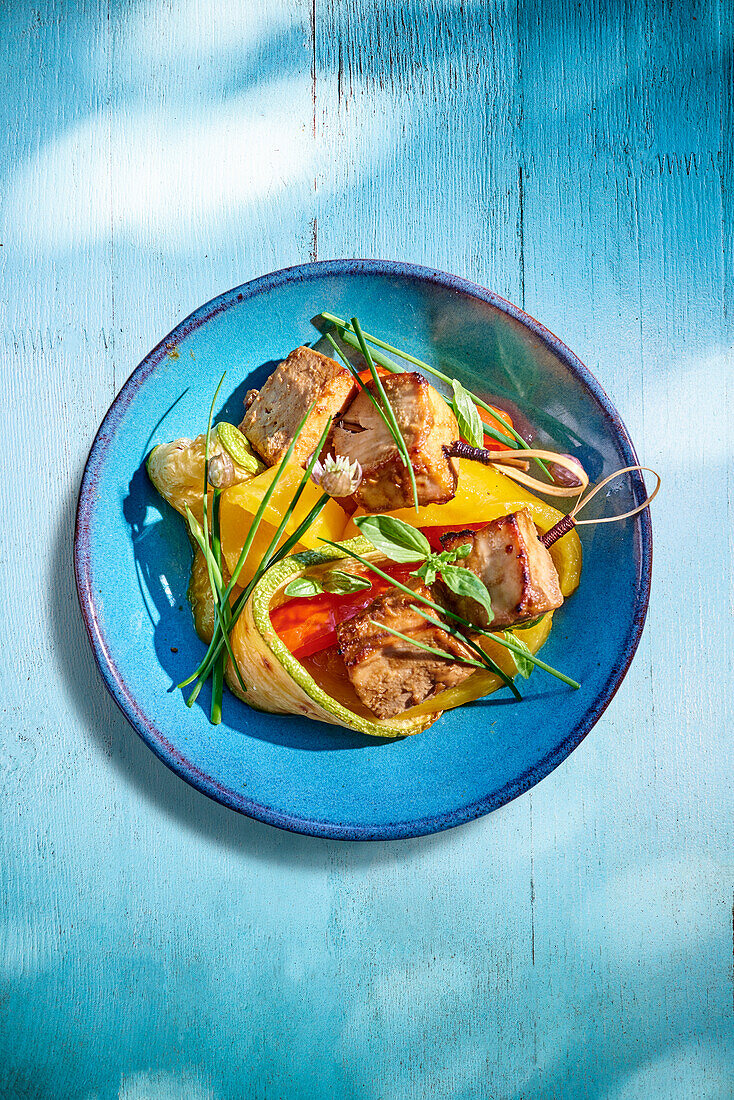 Swordfish with mustard, peppers and courgettes