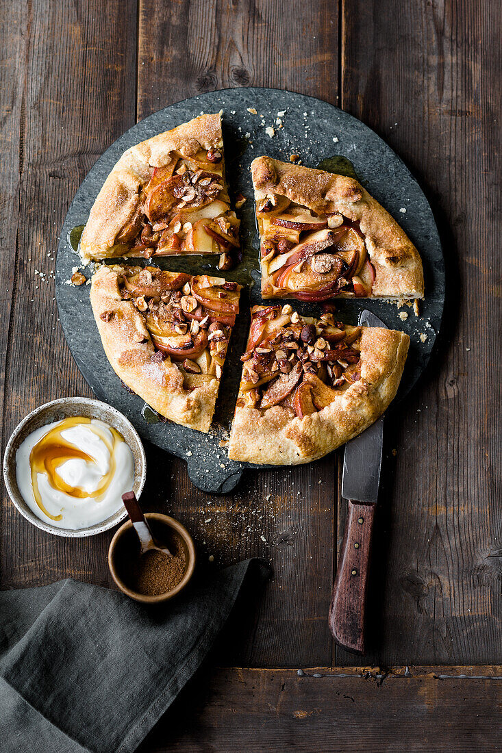 Vegan apple galette with nuts and vegetable-based yoghurt