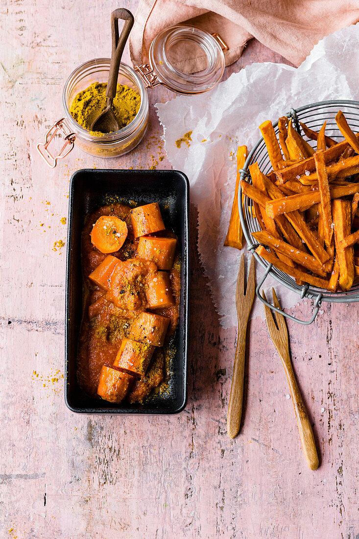 Curried carrots à la 'Currywurst' with ketchup and sweet potato fries