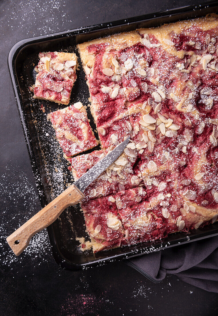 Vegan strawberry-vanilla tray bake cake with almonds