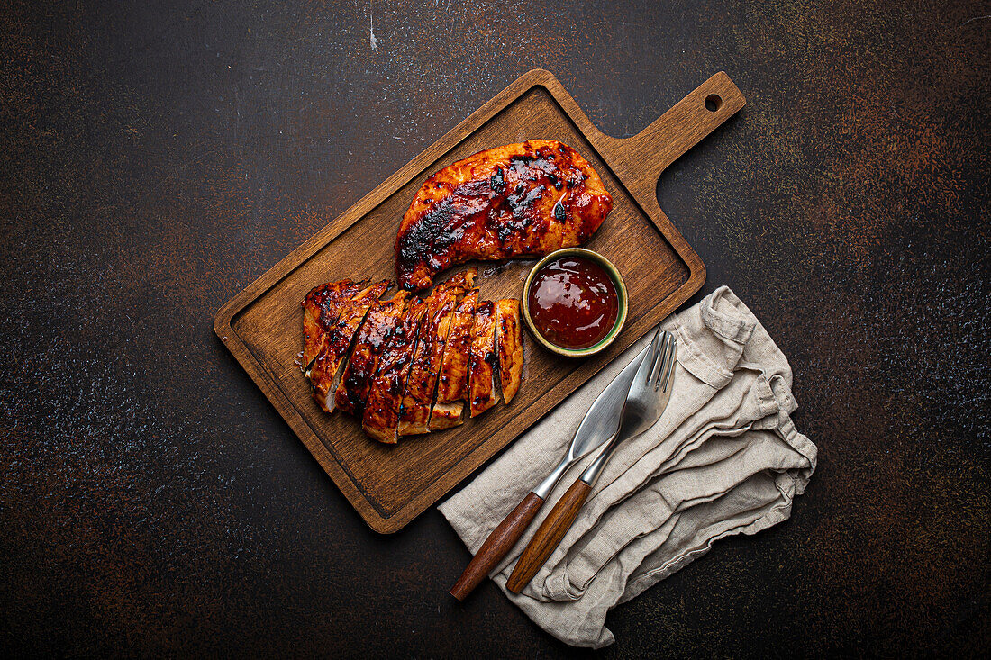 Grilled turkey marinated fillet with red sauce