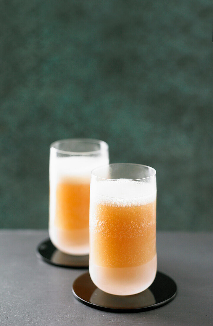 Bellini with white peach flesh, sugar syrup, peach purée and prosecco
