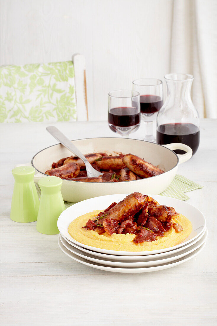Braised Italian sausages with soft polenta