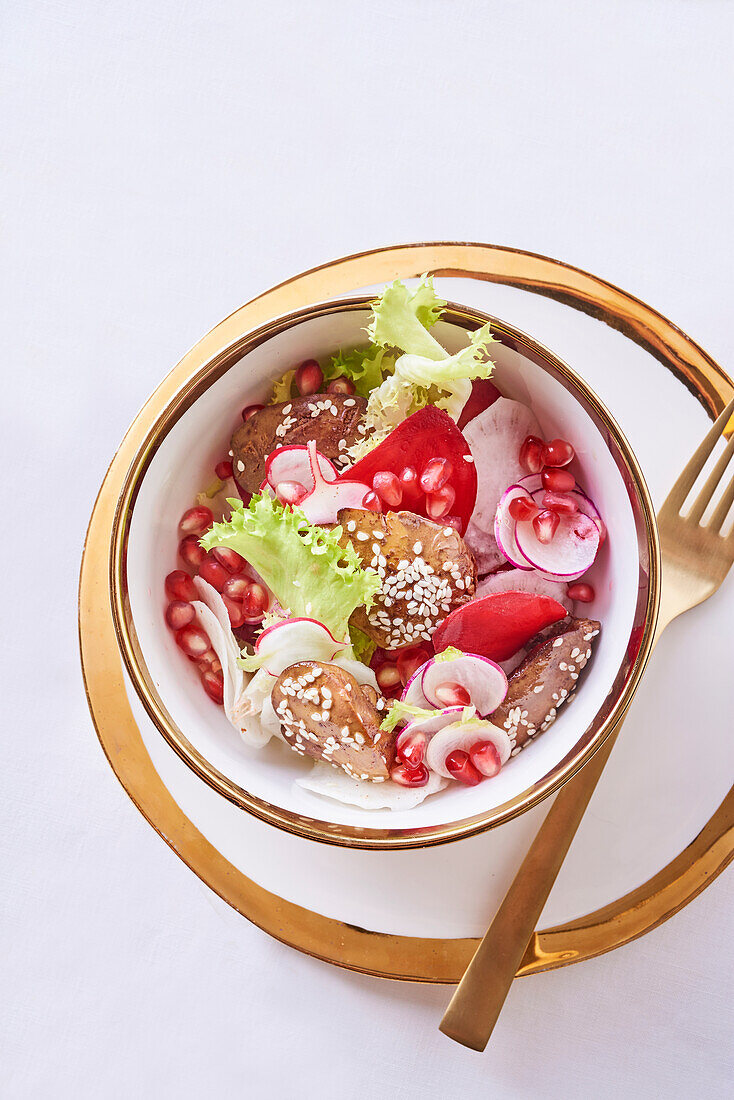 Chicken liver with radishes and pomegranate seeds