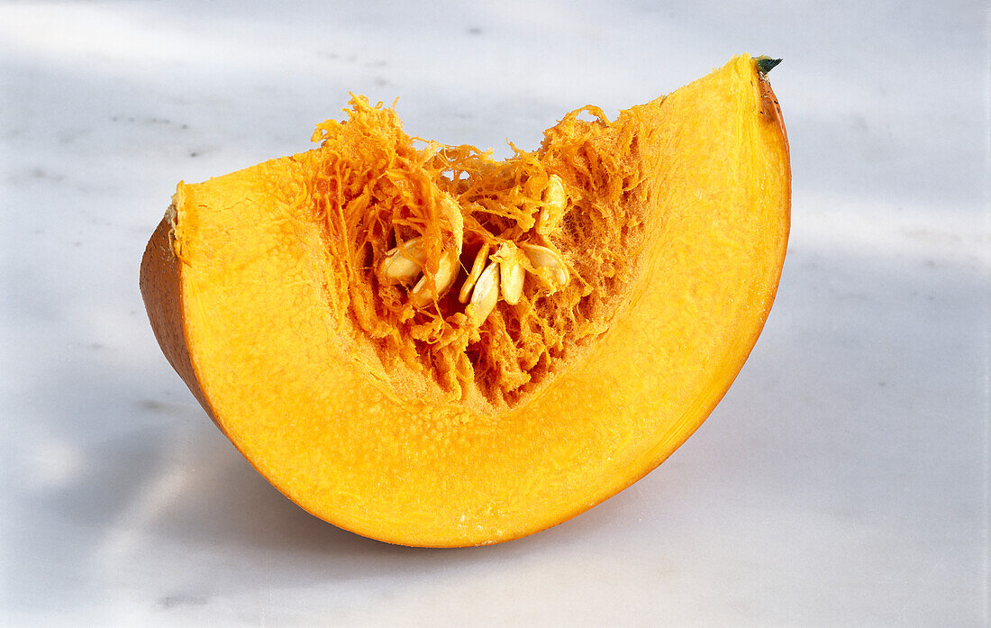 Pumpkin wedge on a white background