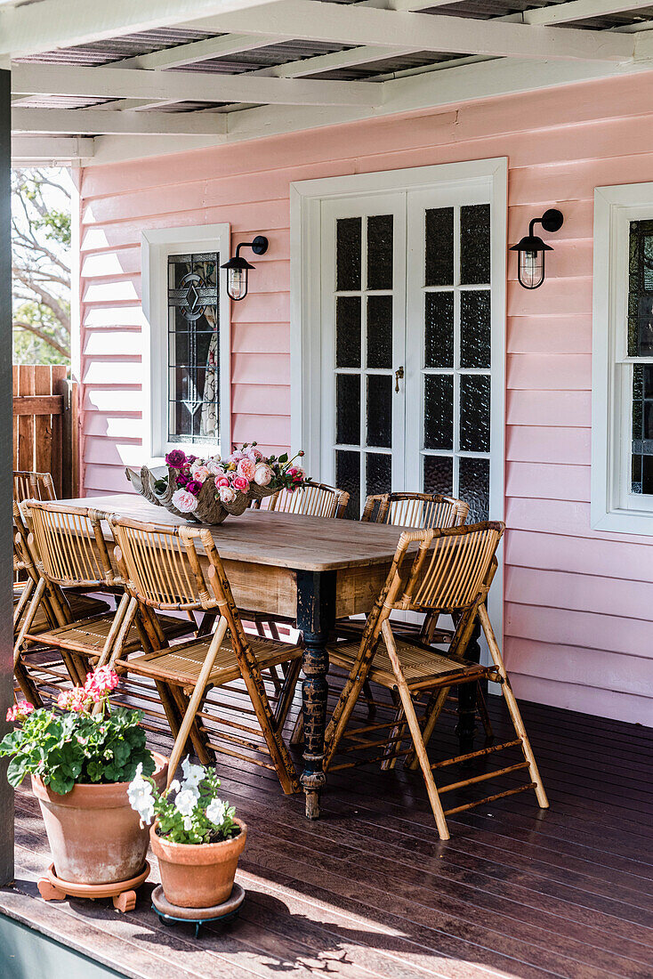 Table and folding cane chairs