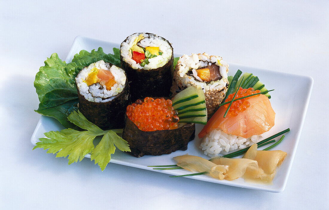 Sushi plate with nigiri, maki, ura-maki, and gunkan-maki