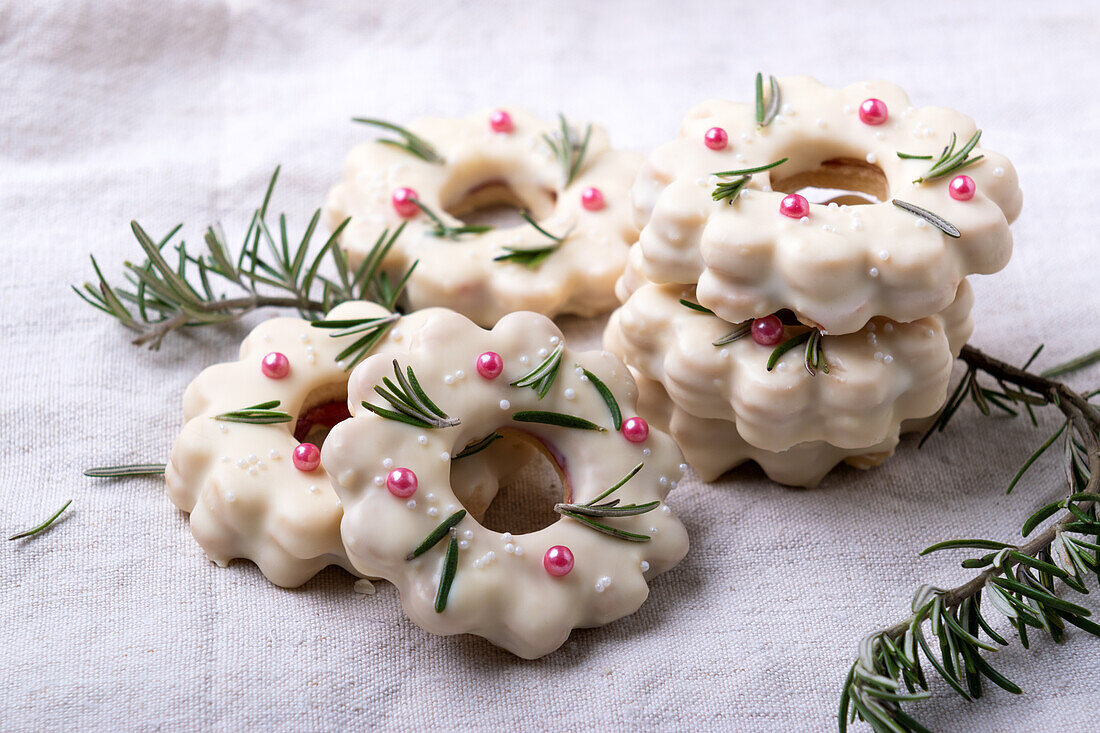 Christmas wreath Cookies filled with jam, coated with white rice milk chocolate, vegan