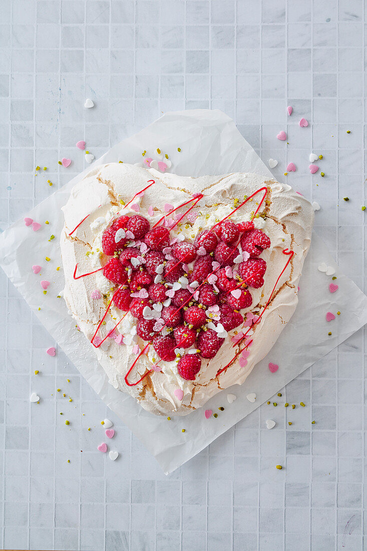 Pavlova with raspberries as a heart for Valentine's Day