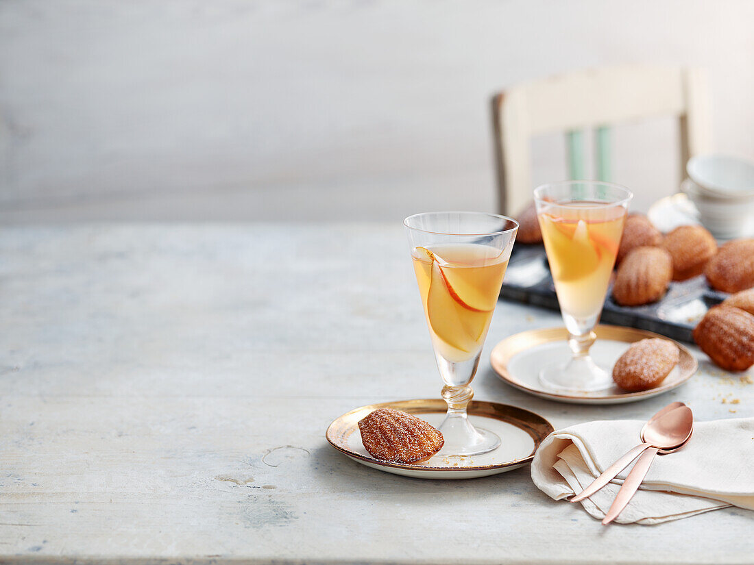 Wine jelly with pear and ginger served with ginger madeleines