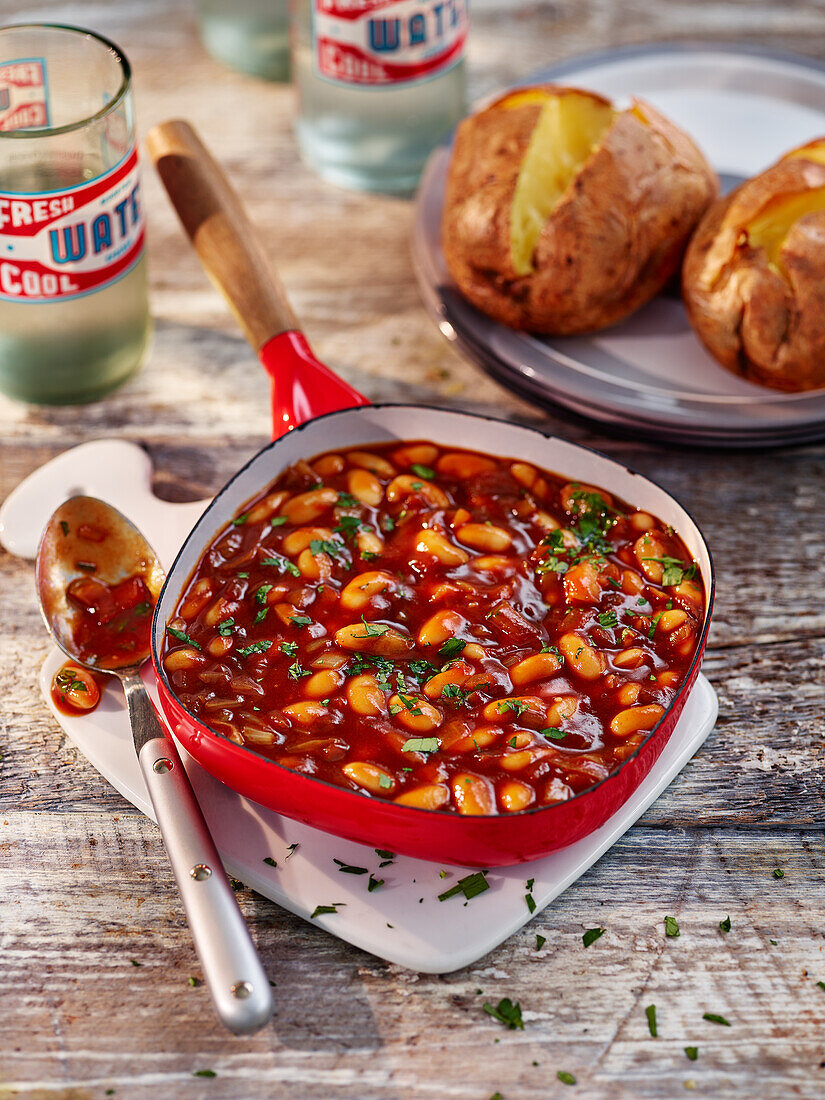 Homemade baked beans served with Baked potatoes