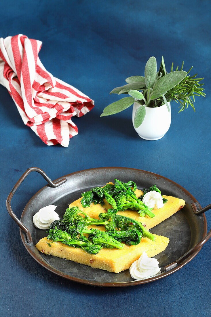 Polenta crostini with broccolini and goat cheese
