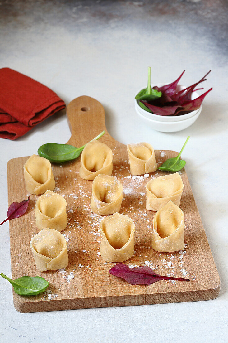 Homemade tortelloni with ricotta, dried apricots, and spices