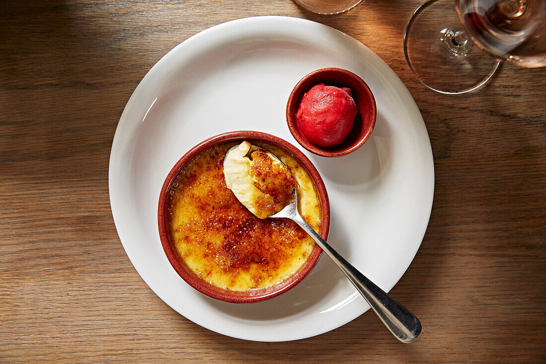 Crème Brûlée with a strawberry sorbet